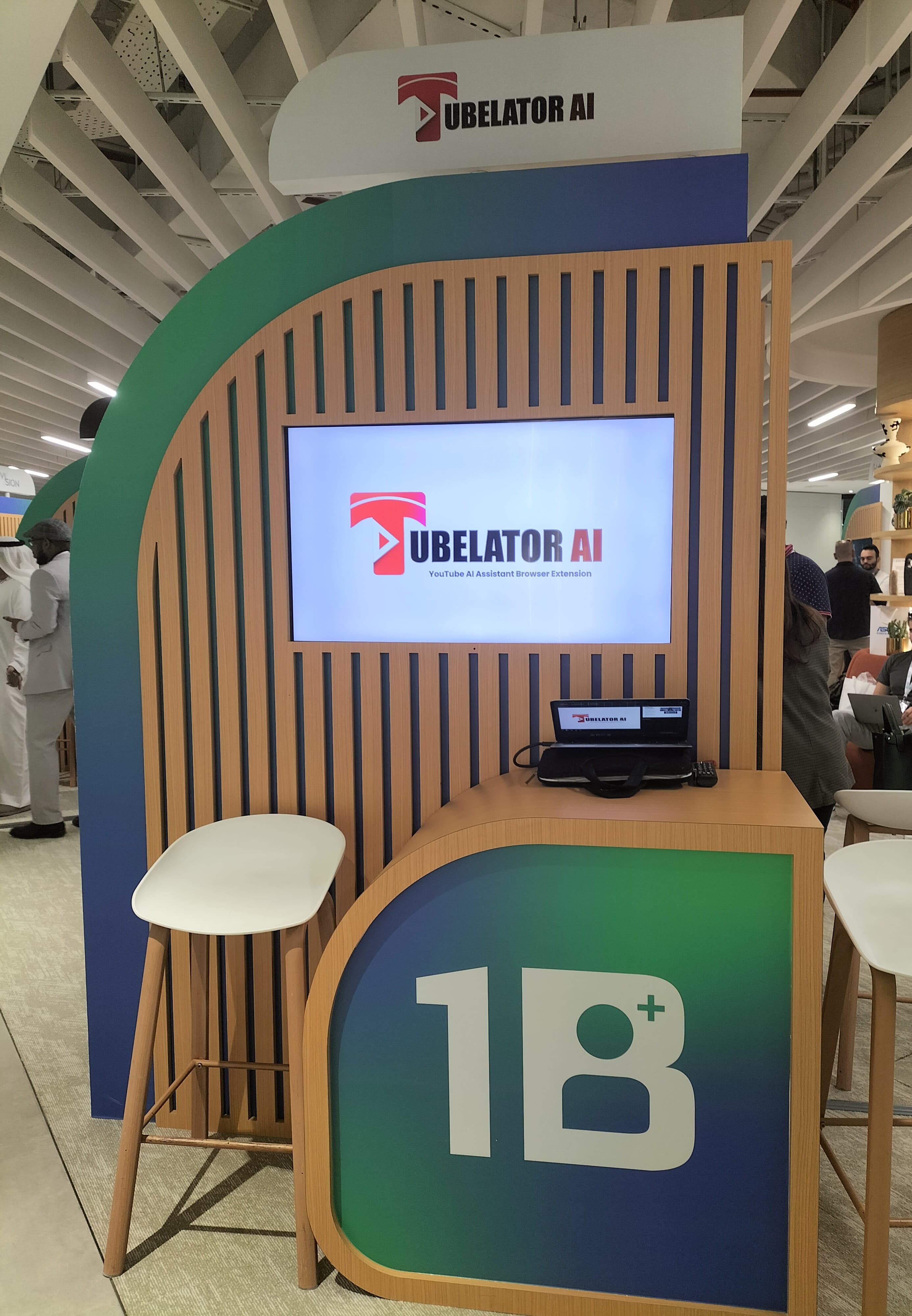 The Tubelator AI stand at the 1 Billion Followers Summit in Dubai, with the product shown on screen.